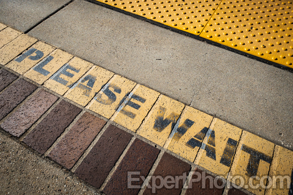 Nice photo of Please wait Sign